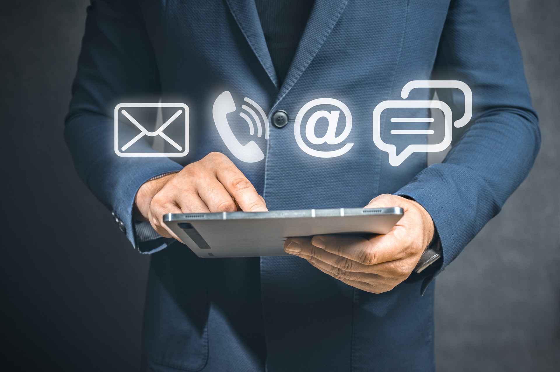 Contact us or Customer support hotline people connect. . Close up businessman holding tablet, using device to contact people or contacting information on business, contact us messaging calling email
